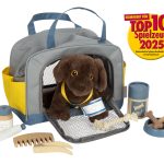 Perro con bolsa de transporte y set de cuidados